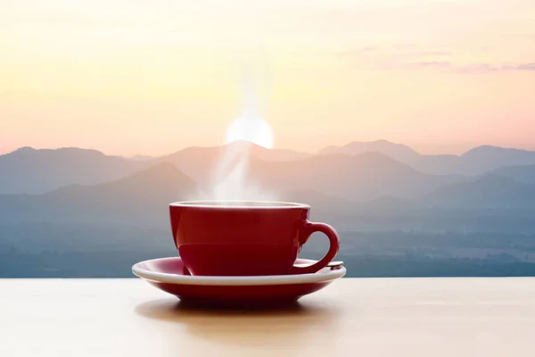 Coffee cup red with morning sunshine mountain view