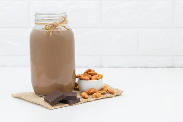 Milk Chocolate Almonds Glass White Background — Stock Photo, Image
