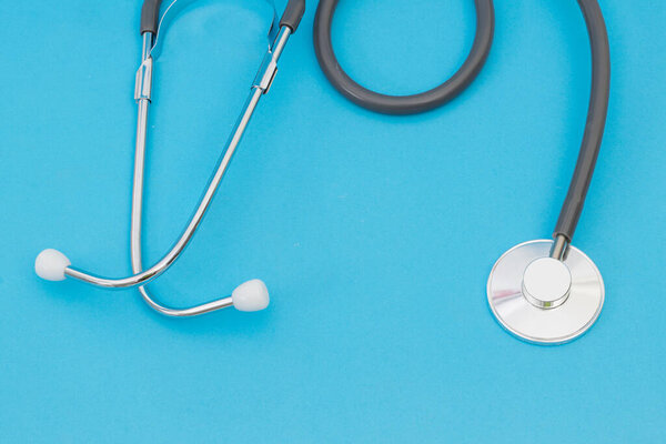 Medical stethoscope on a blue background