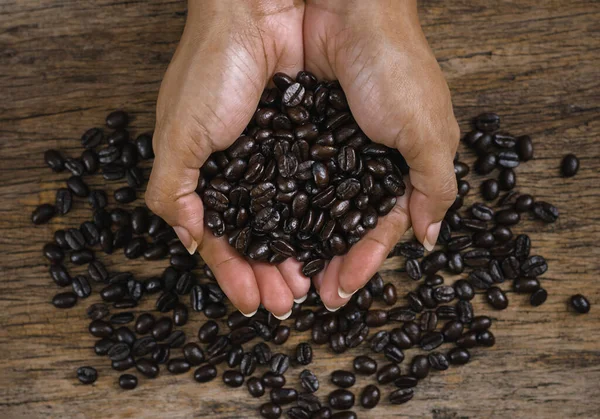 Roasted Coffee Beans Hand Wooden Floors — Stock Photo, Image