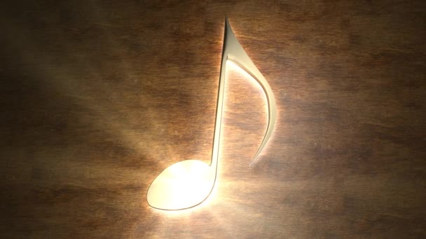 Una nota musicale dorata brilla sul tavolo. La magia della musica. Nota con raggi di luce. 95 95. — Video Stock
