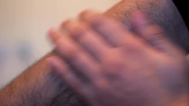 Close View Young Man Touches His Hairy Arm His Hand — Stock Video