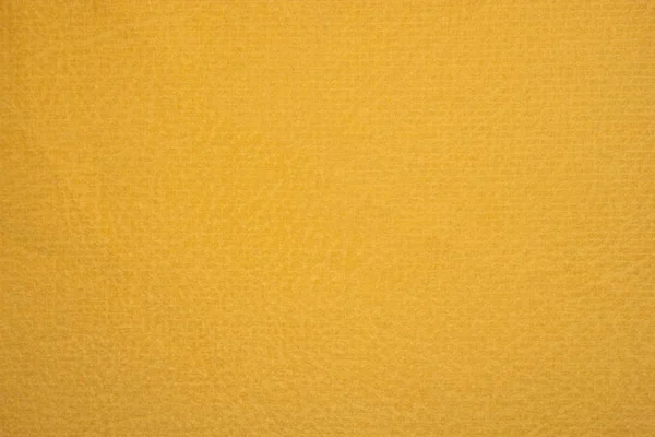 Velour texture of yellow textured fabric.
