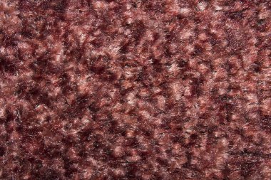 Kırmızı-kahverengi Halı dokusu. Arka plan koyu kırmızı yün halı olduğunu.