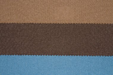 Kumaşlar çok renkli doku örneği. Farklı renkli kumaşların arka plan.