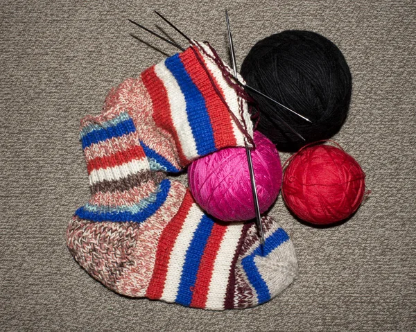 Knitted wool socks.Background knitting wool socks spokes.