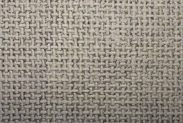 Beige texture in twisted mesh.Background of t-shaped symbols.