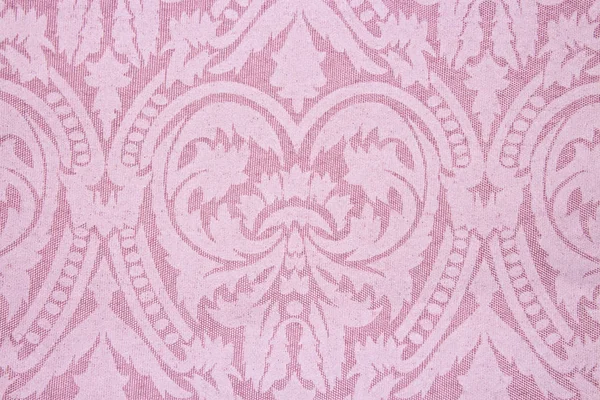 Light pink fabric texture with patterns.Background pink with lace.