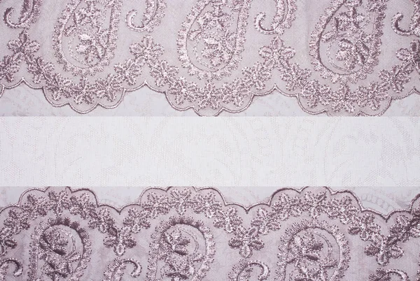 Light pink fabric texture with patterns.Background pink with lace.