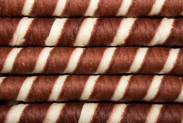 Wafer rolls with chocolate filling.Background of wafer tubules with the chocolate.