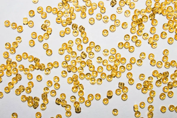 Background of yellow amber beads.Texture of yellow beads.