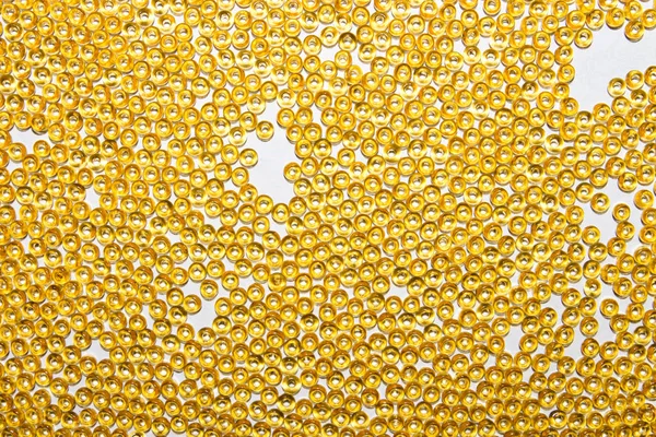 Background of yellow amber beads.Texture of yellow beads.