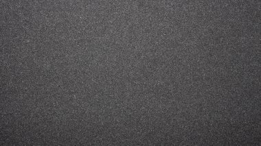 Siyah zımpara kağıdı dokusu. Koyu gri kaba arka plan.