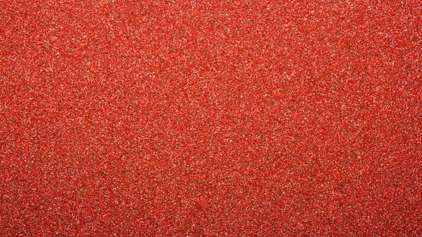 Texture of red sandpaper.Rough sandpaper background.