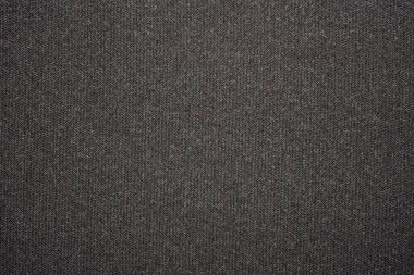 Doku siyah, sıkı halı. Halıların koyu arkaplanı..