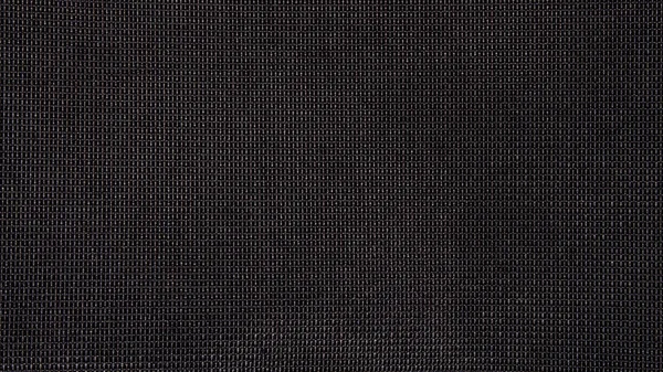 Black fabric texture in a small square cell.Background fabric in a square grid.