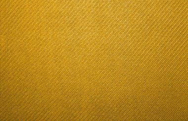 Altın örgü kumaş. Sarı kumaş doku.
