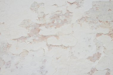 Eski beyaz soyulmuş duvarın dokusu. Eski beyaz boyanın arka planı.