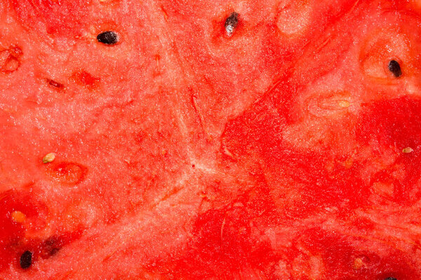 Ripe red watermelon.Texture of red watermelon with bones.Background of juicy watermelon.