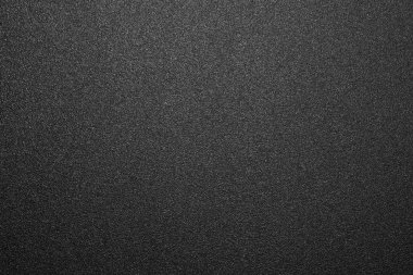 Siyah mat plastik doku. Siyah ve beyaz mat arka plan. Arka plan siyah pürüzlü plastik.