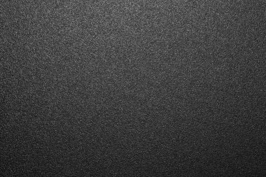 Siyah mat plastik doku. Siyah ve beyaz mat arka plan. Arka plan siyah pürüzlü plastik.