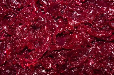 Pancar rendelenmiş haşlanmış. Kaba rende üzerine rendelenmiş pancar arka plan.