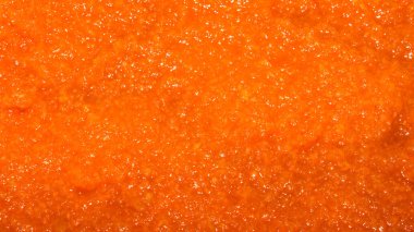 Havuç püresi. Blender içinde ezilmiş havuç. Rendelenmiş havuç arka planı..