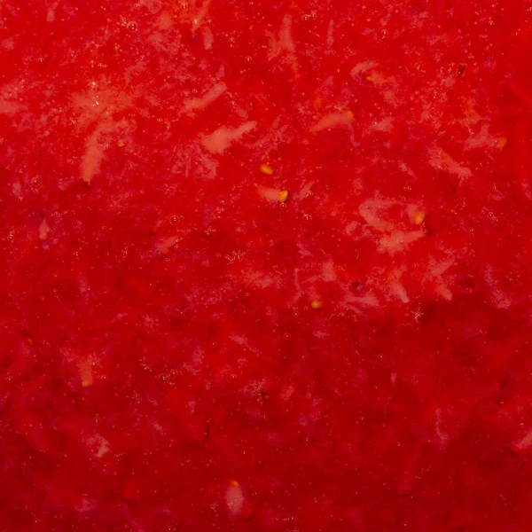 Crushed strawberries.The texture of the strawberries.Background of strawberry top view.