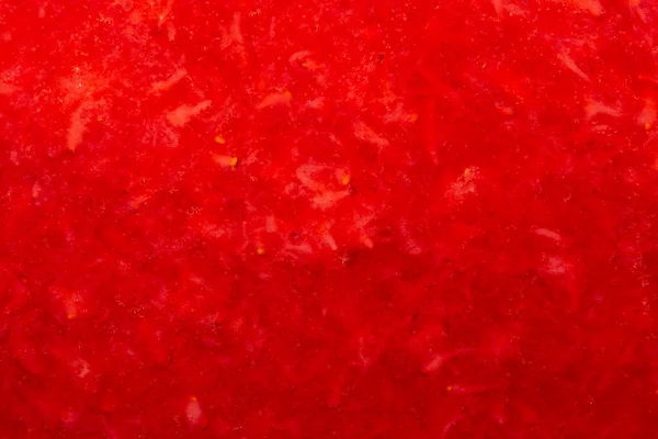 Crushed strawberries.The texture of the strawberries.Background of strawberry top view.