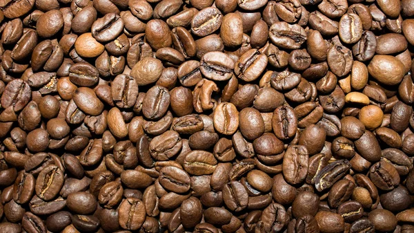 コーヒー豆の上からの眺めコーヒー豆の質感コーヒー豆の背景 — ストック写真