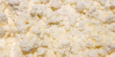 Süzme peynir arka planı. Yoğunlaştırılmış sütlü süzme peynir..