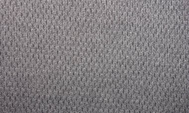 Kumaşın dokusu siyah benekli gri. Benekli tekstil içeren gri arkaplan..