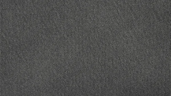The fabric texture is fluted grey.The background of dense dark-gray patterned fabric.