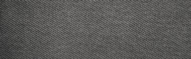 Koyu gri kumaşın dokusu çizgili flüt gibidir. Yoğun gri kumaşın arka planı.