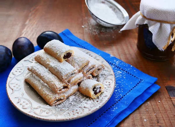 Plate Biscuit Rolls Filled Plum Jam Powdered Sugar Blue Napkin — Stock Photo, Image