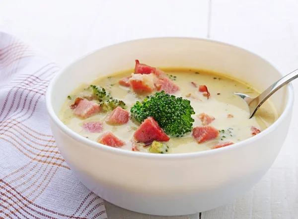 Creamy broccoli cheese soup in white bowl — Stock Photo, Image