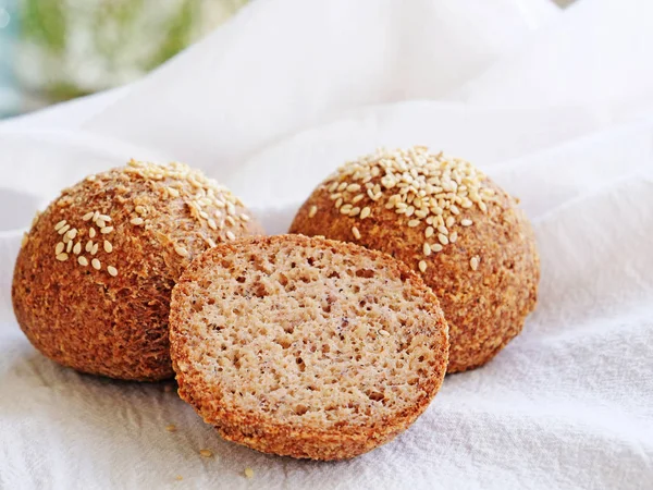 Tasty almond flour bread, homemade keto buns with crust and sesame seeds
