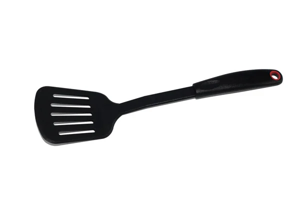 Ladle, spatula and skimmer from food plastic in black on a white background, isolate, kitchen utensils Stock Picture