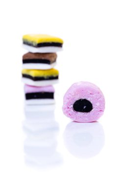 Liquorice all sorts isolated on white stacked on each other clipart