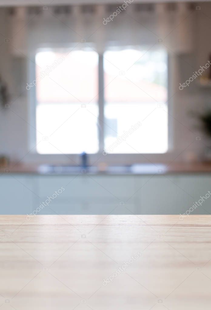 kitchen surface wooden counter top with interior blurry in the background