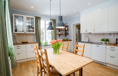 kitchen with flowers and chairs on background