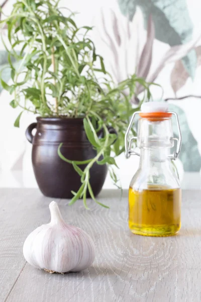 food ingredients on table, olive oil and garlic and fresh herbs