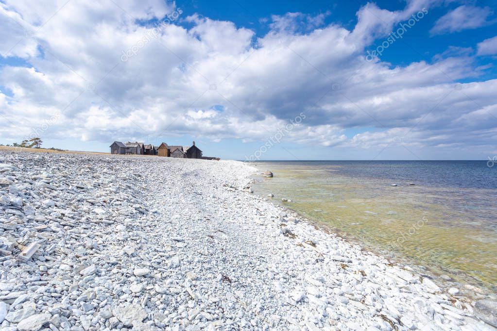 fishing huts in Fr Gotland Helgumannens fiskelge with sea horizon in the background 