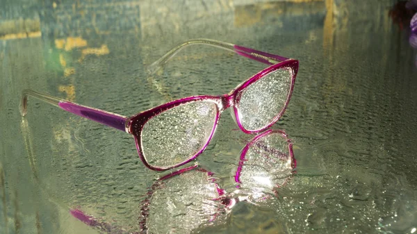 wet glasses on wet ground