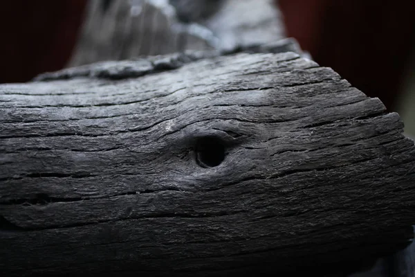 Burned wood. black wood from the fire. Rings on wood. Ash. Wood burnt on coal