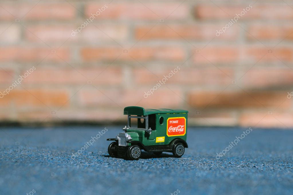Valencia - Spain, February 13, 2019: old toy truck with coca cola logo on unfocused background.