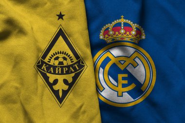 Pringsewu, Lampung; 16 Eylül 2025; UEFA Şampiyonlar Ligi maçında Real Madrid 'e karşı Kairat futbol kulübü logosunun orijinal dalgalı kumaşı