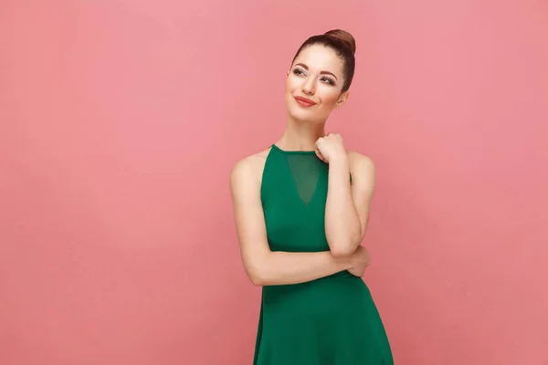 Pensive Beautiful Woman Collected Hair Green Dress Dreaming Looking Pink — Stock Photo, Image