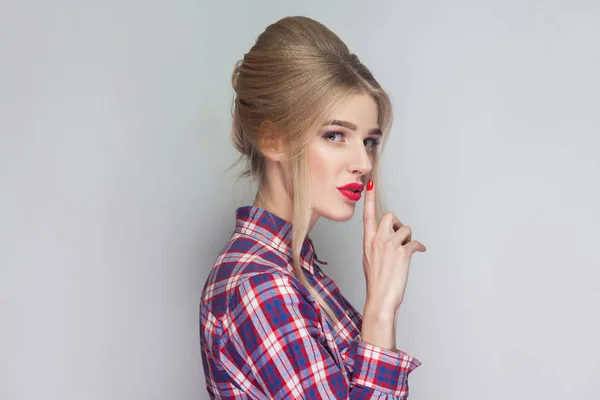 Young Blonde Woman Looking Camera Finger Red Lips Gray Background — Stock Photo, Image