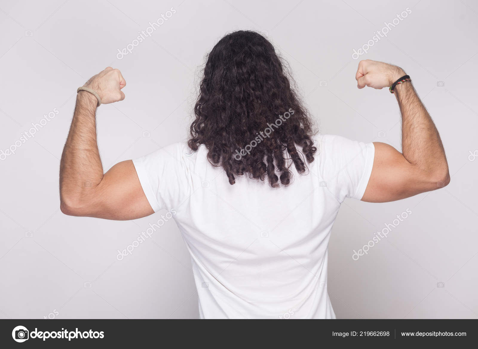 Back View Strong Bodybuilder Man White Shirt Long Wavy Hair